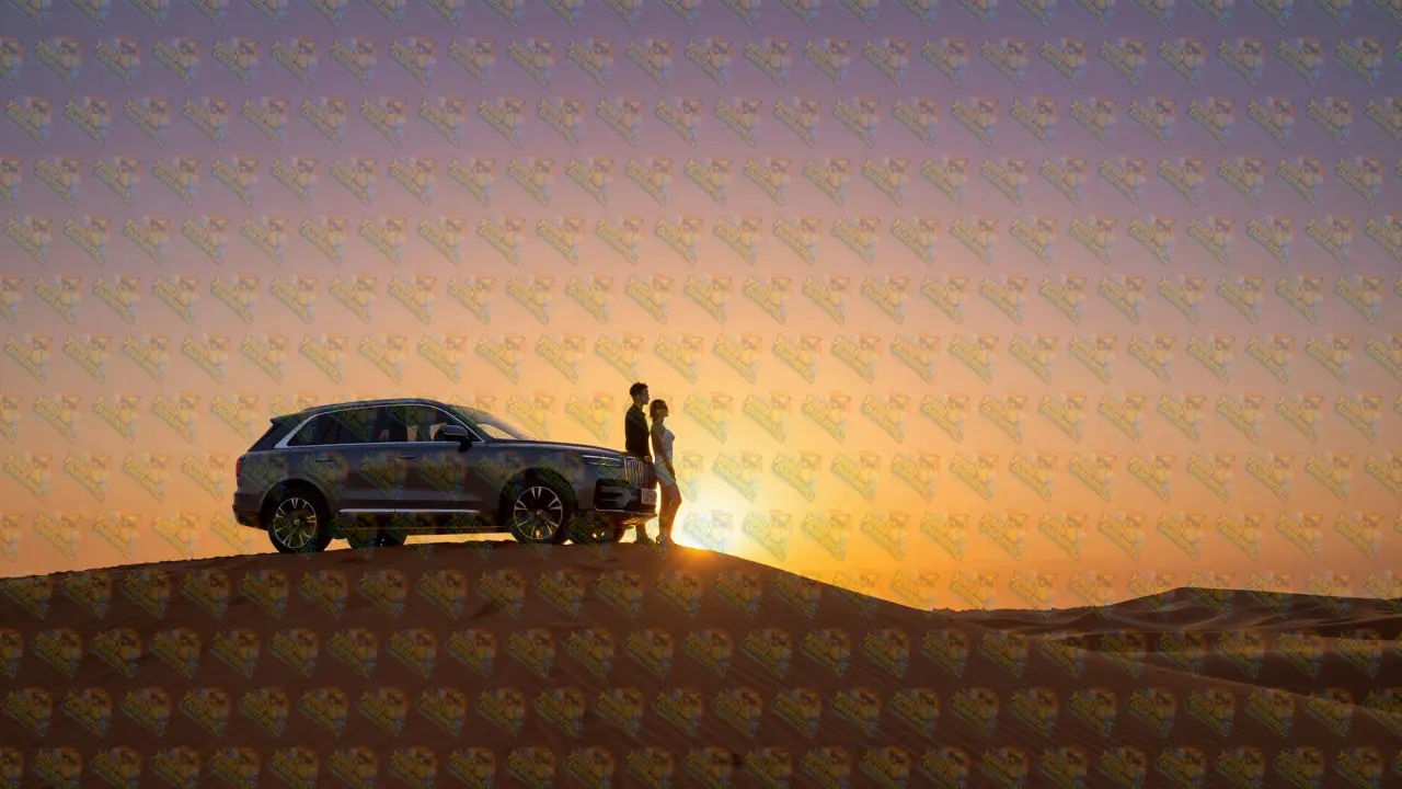 A couple watching a vibrant orange sunset from the top of a desert dune.
