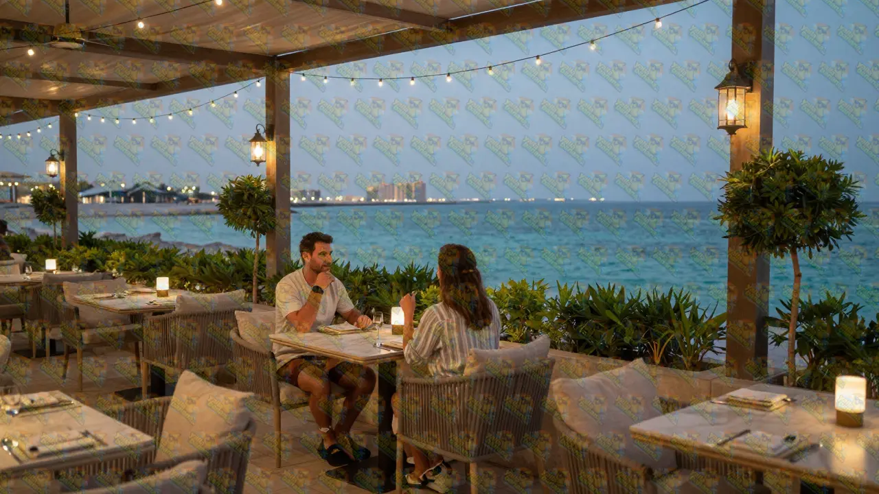 Elegant couple dining on a breezy seaside terrace on Saadiyat Island